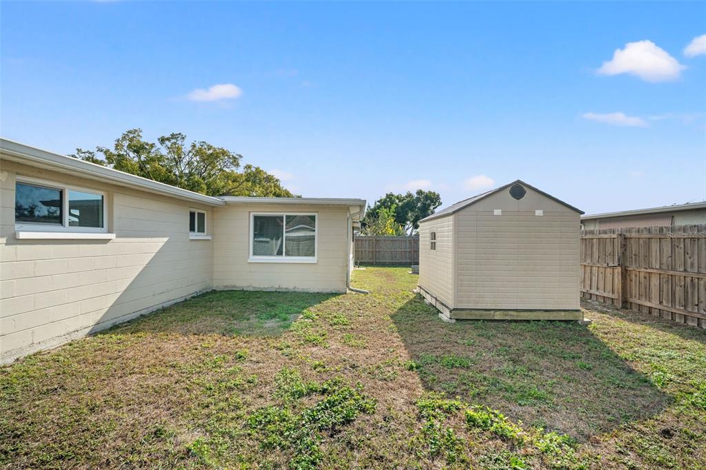 3709 Panola Drive New Port Richey, FL 34652 - Photo 27 of 36 a view of a backyard of the house