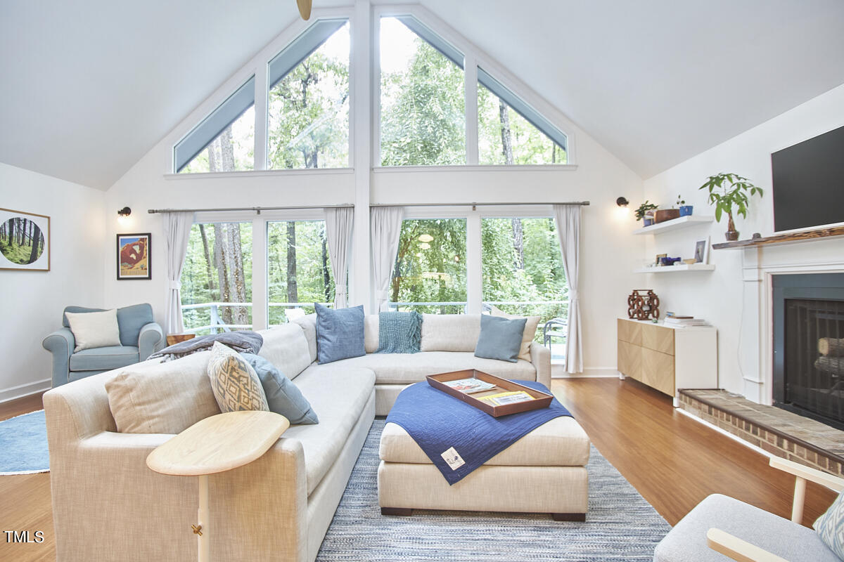 2803 McDowell Road Durham, NC 27705 - Photo 19 of 81 a living room with furniture and a large window