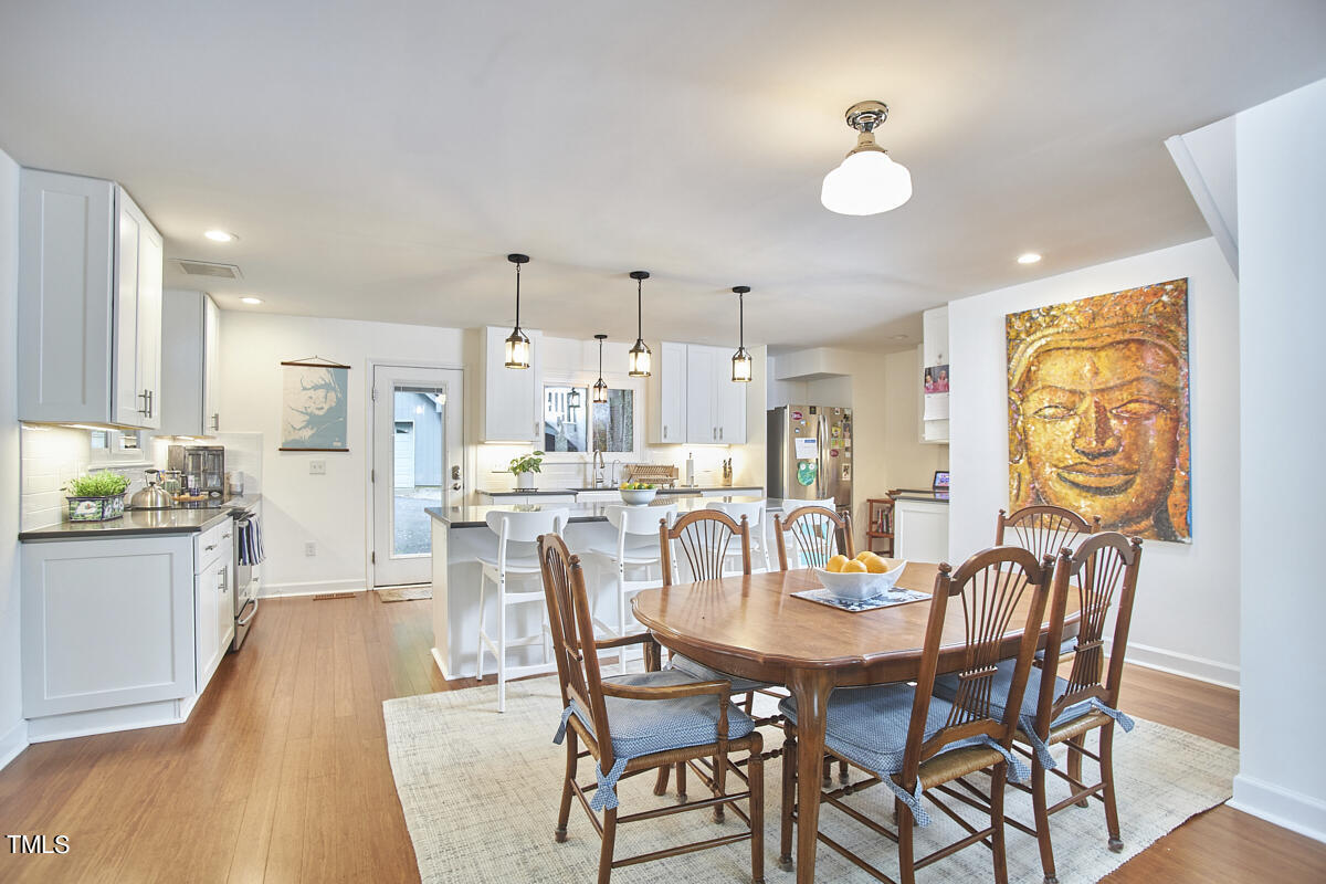 2803 McDowell Road Durham, NC 27705 - Photo 22 of 81 a view of a dining room with furniture and wooden floor