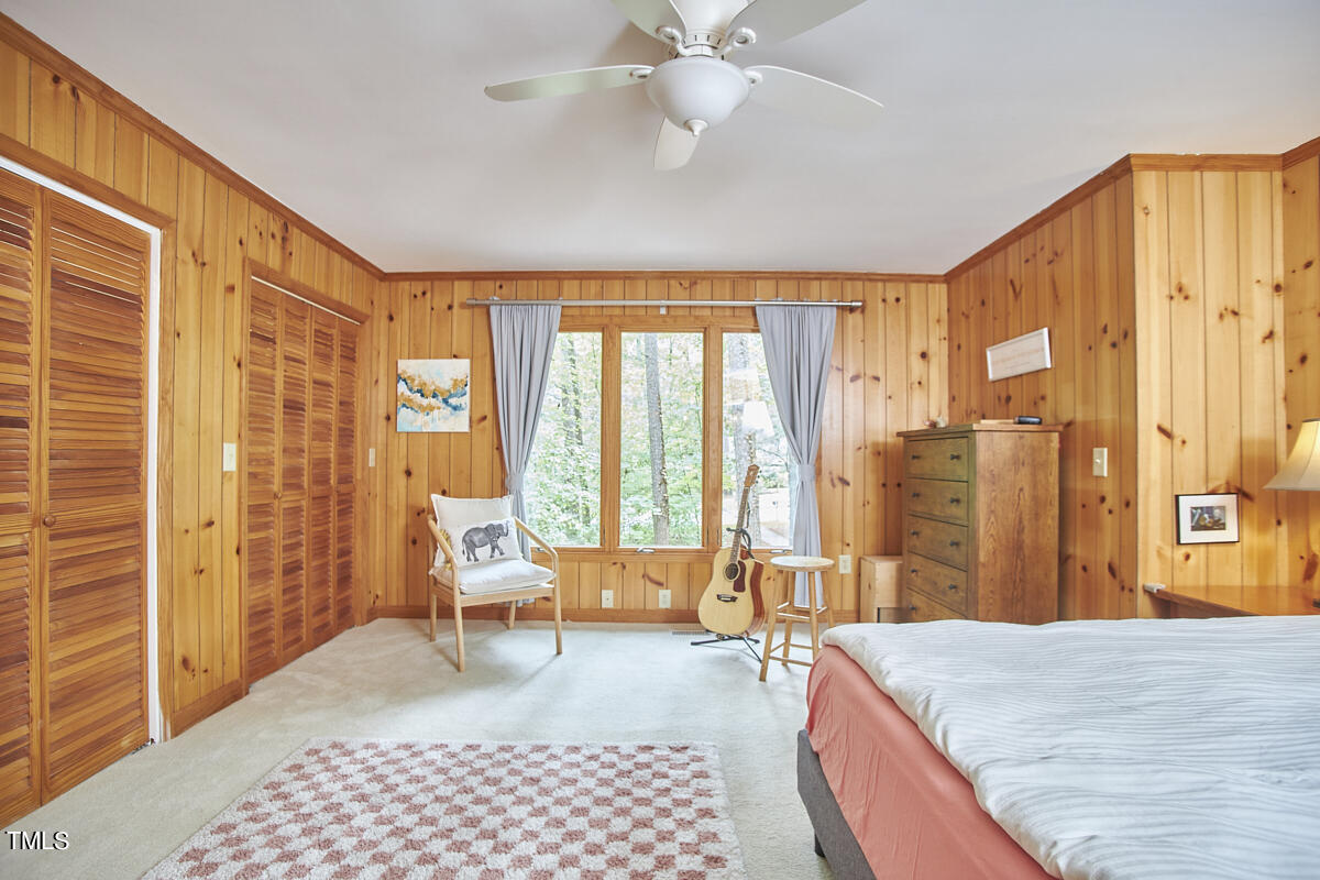 2803 McDowell Road Durham, NC 27705 - Photo 42 of 81 a bedroom with a bed and glass door