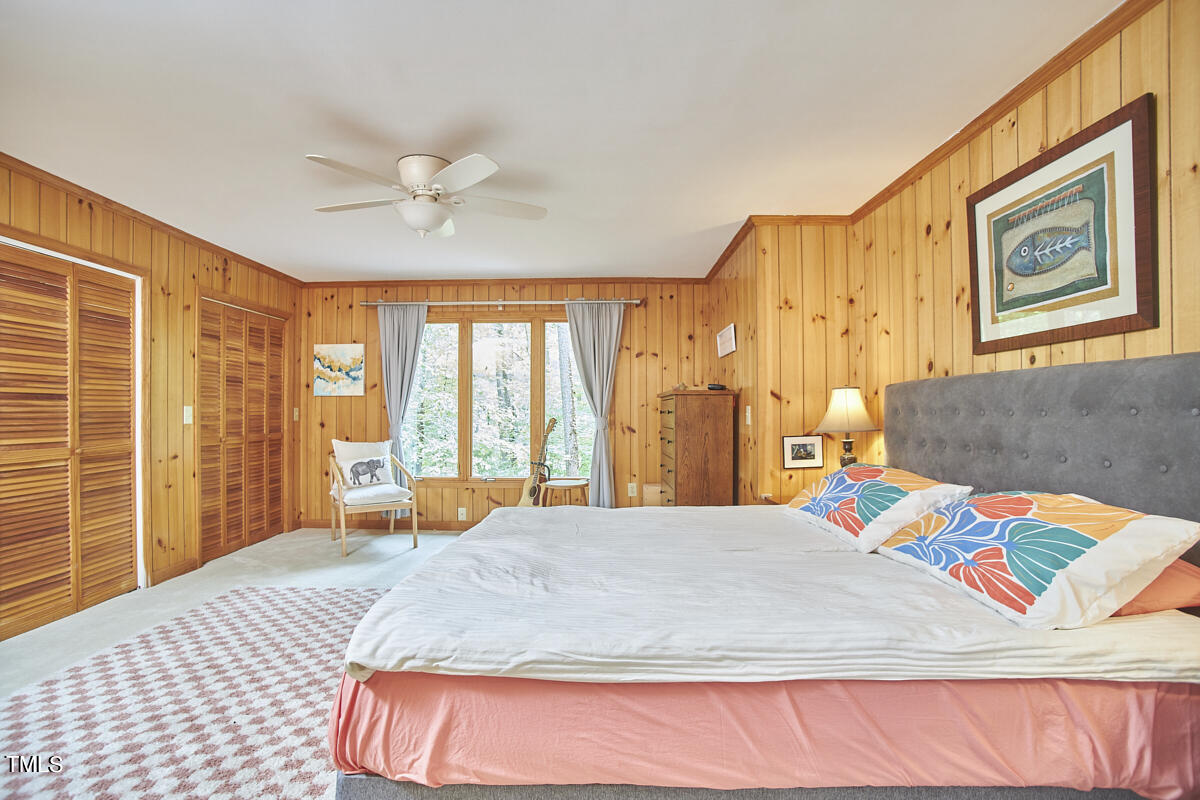 2803 McDowell Road Durham, NC 27705 - Photo 43 of 81 a bedroom with a bed and a large window