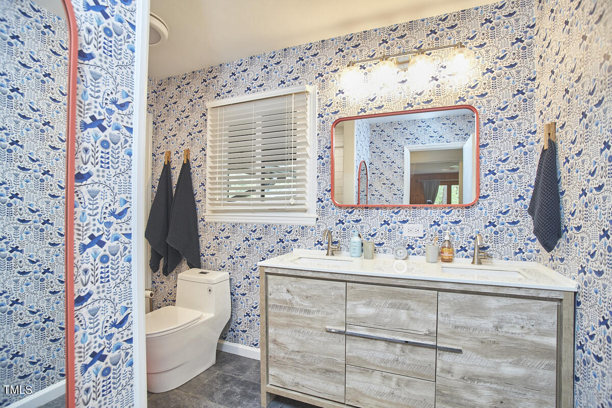 2803 McDowell Road Durham, NC 27705 - Photo 46 of 81 a bathroom with a sink toilet and shower