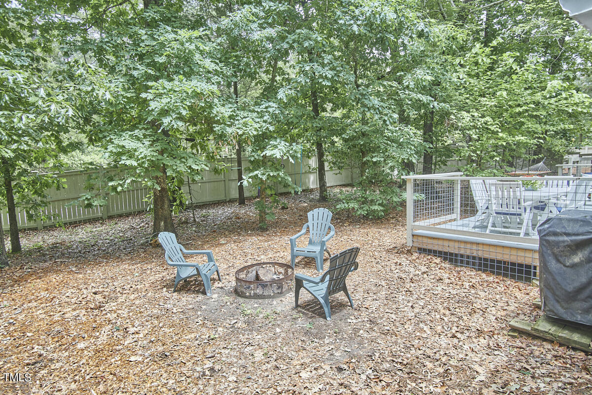 2803 McDowell Road Durham, NC 27705 - Photo 66 of 81 a view of a chair and fire pit in the backyard