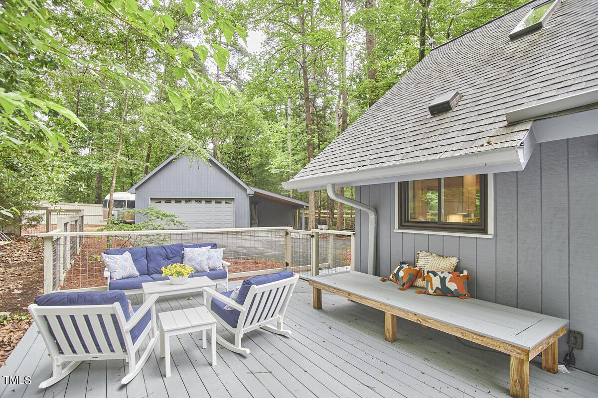 2803 McDowell Road Durham, NC 27705 - Photo 68 of 81 a view of deck with table and chairs and wooden floor