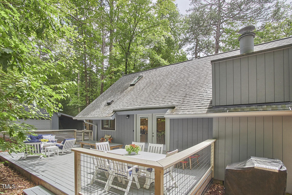 2803 McDowell Road Durham, NC 27705 - Photo 71 of 81 a view of house with a chairs and table in a patio