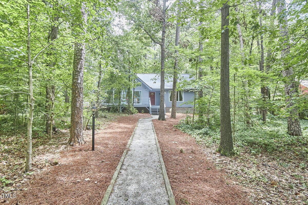 2803 McDowell Road Durham, NC 27705 - Photo 81 of 81 a view of a house with backyard and a trees