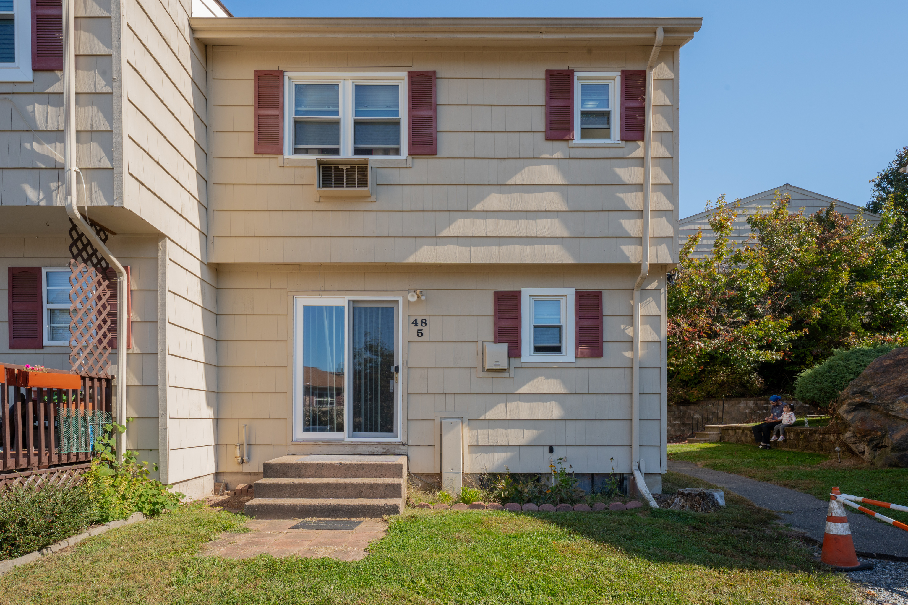 front view of a house with a yard