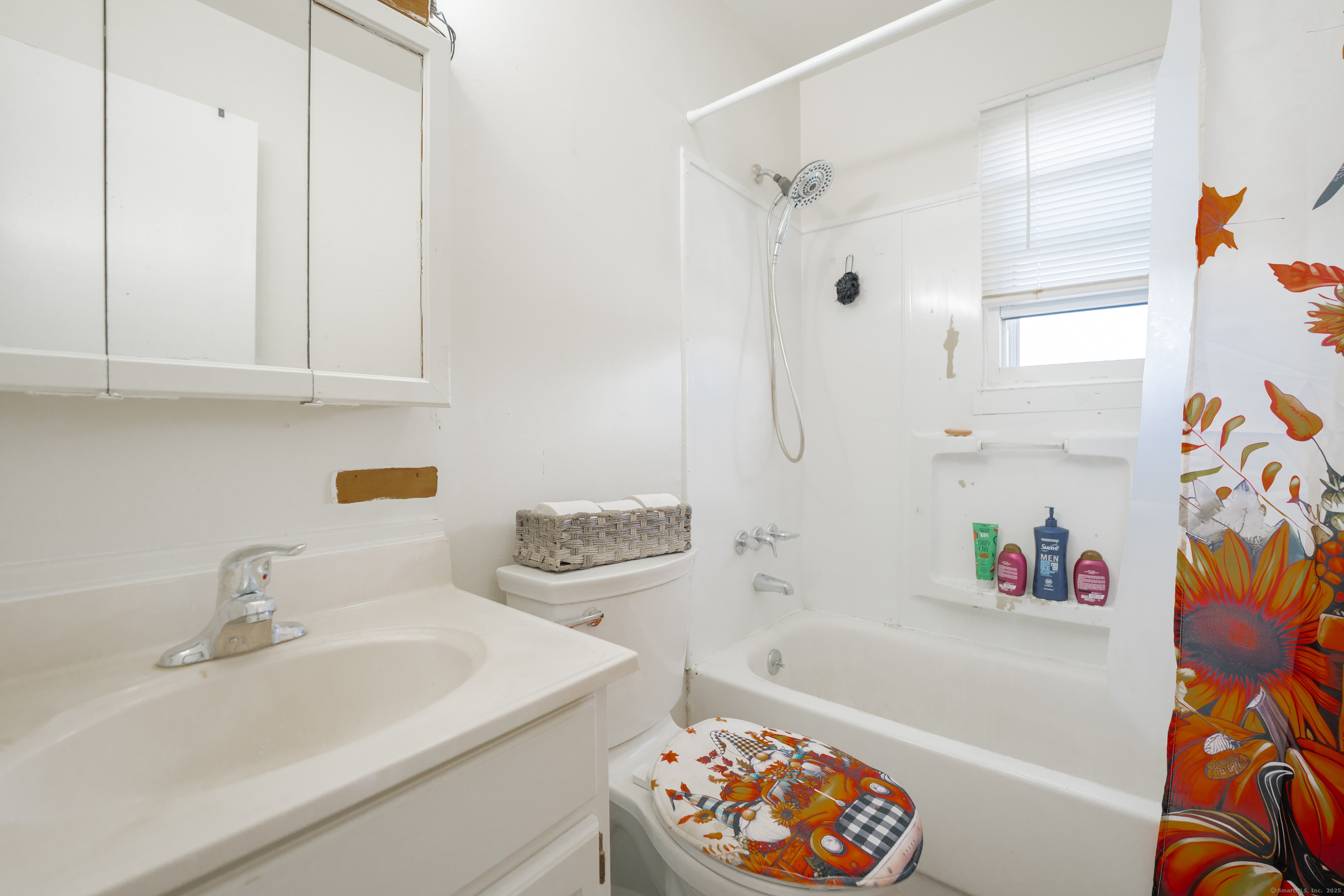 48 Round Tree Drive, Unit 5 Naugatuck, CT 06770 - Photo 2 of 13 a bathroom with a sink a bathtub and a shower