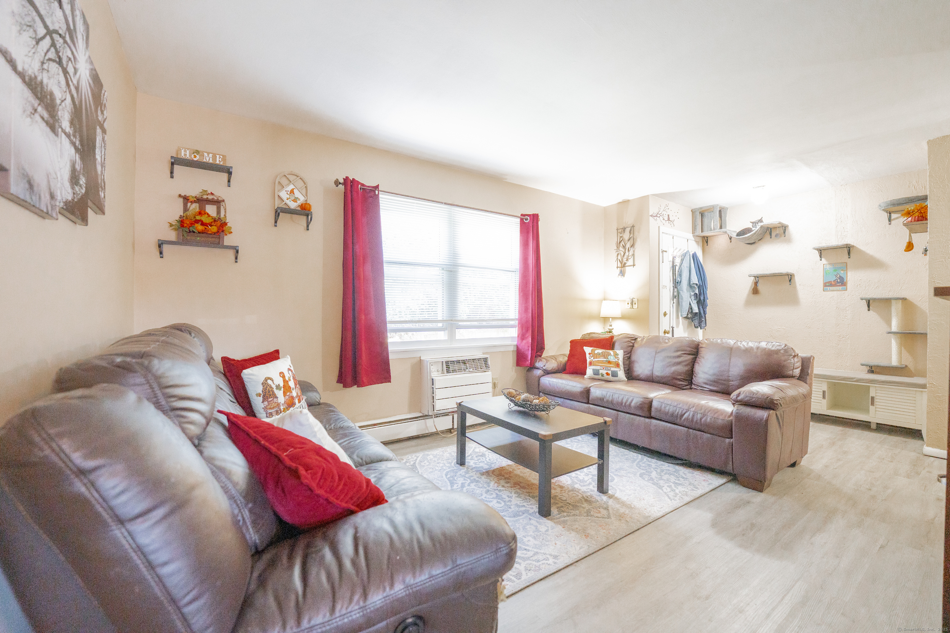 48 Round Tree Drive, Unit 5 Naugatuck, CT 06770 - Photo 2 of 13 a living room with furniture and a large window