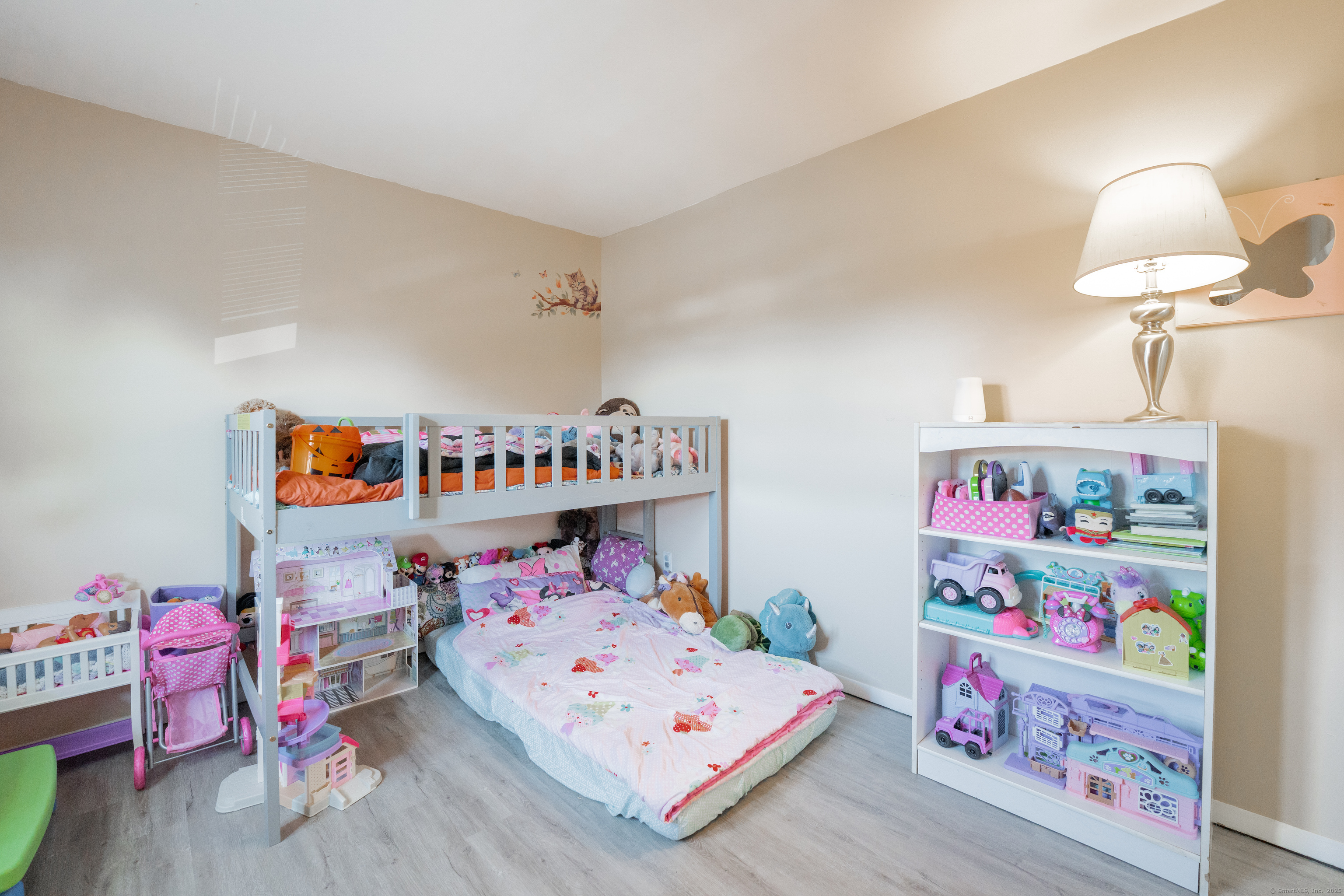 48 Round Tree Drive, Unit 5 Naugatuck, CT 06770 - Photo 9 of 13 a bedroom with baby toys and wooden floor