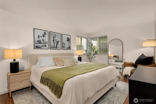 a bedroom with bed and a night stand