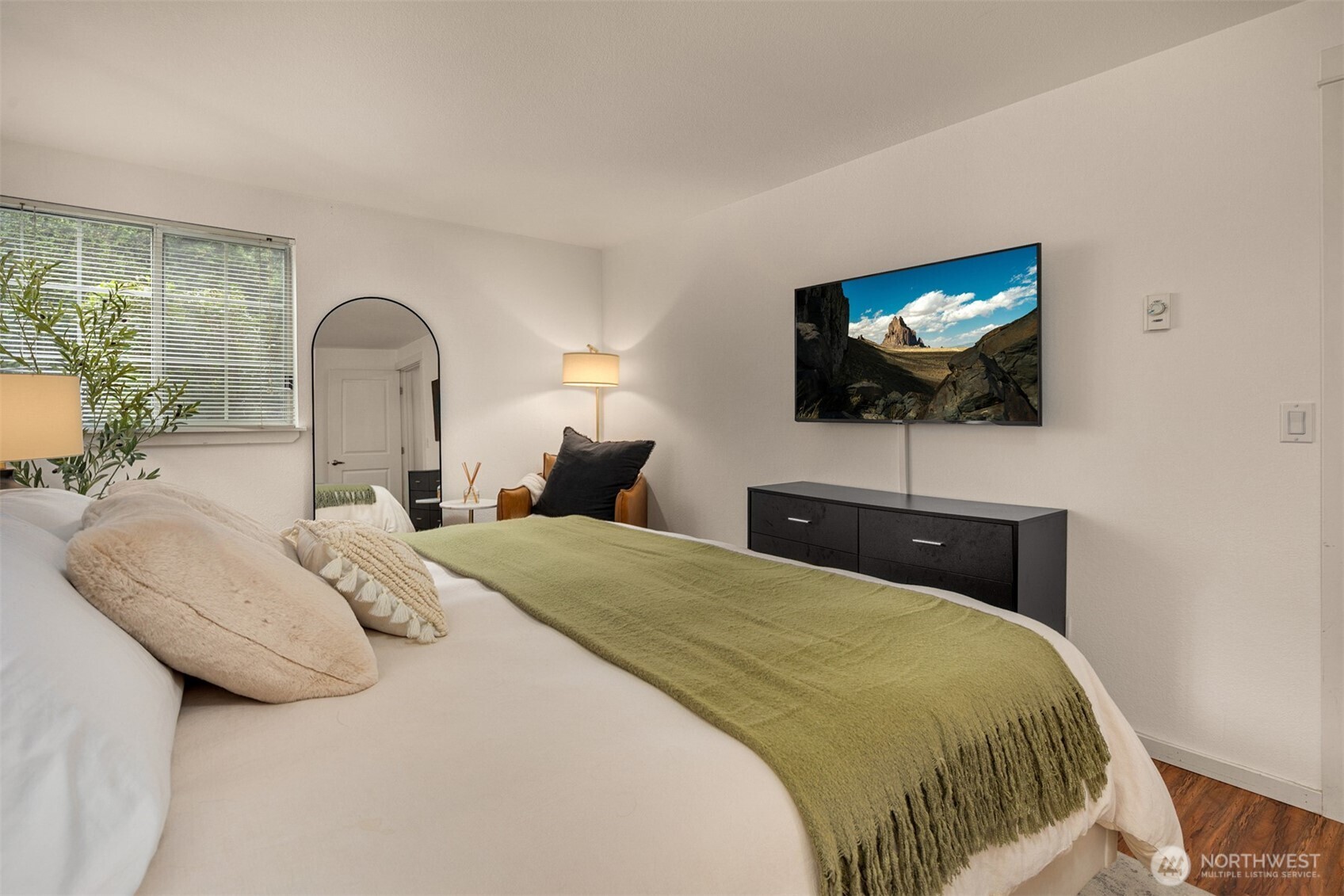 215 9th Street, Unit D102 Kirkland, WA 98033 - Photo 20 of 32 a bedroom with a bed and a flat screen tv