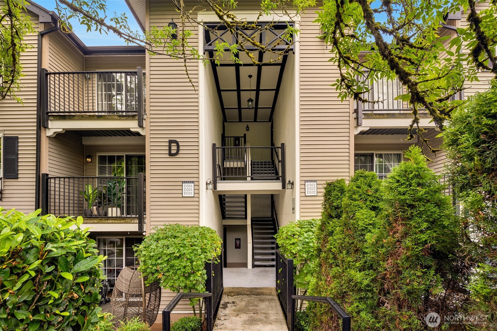215 9th Street, Unit D102 Kirkland, WA 98033 - Photo 2 of 32 a front view of house with yard and outdoor seating