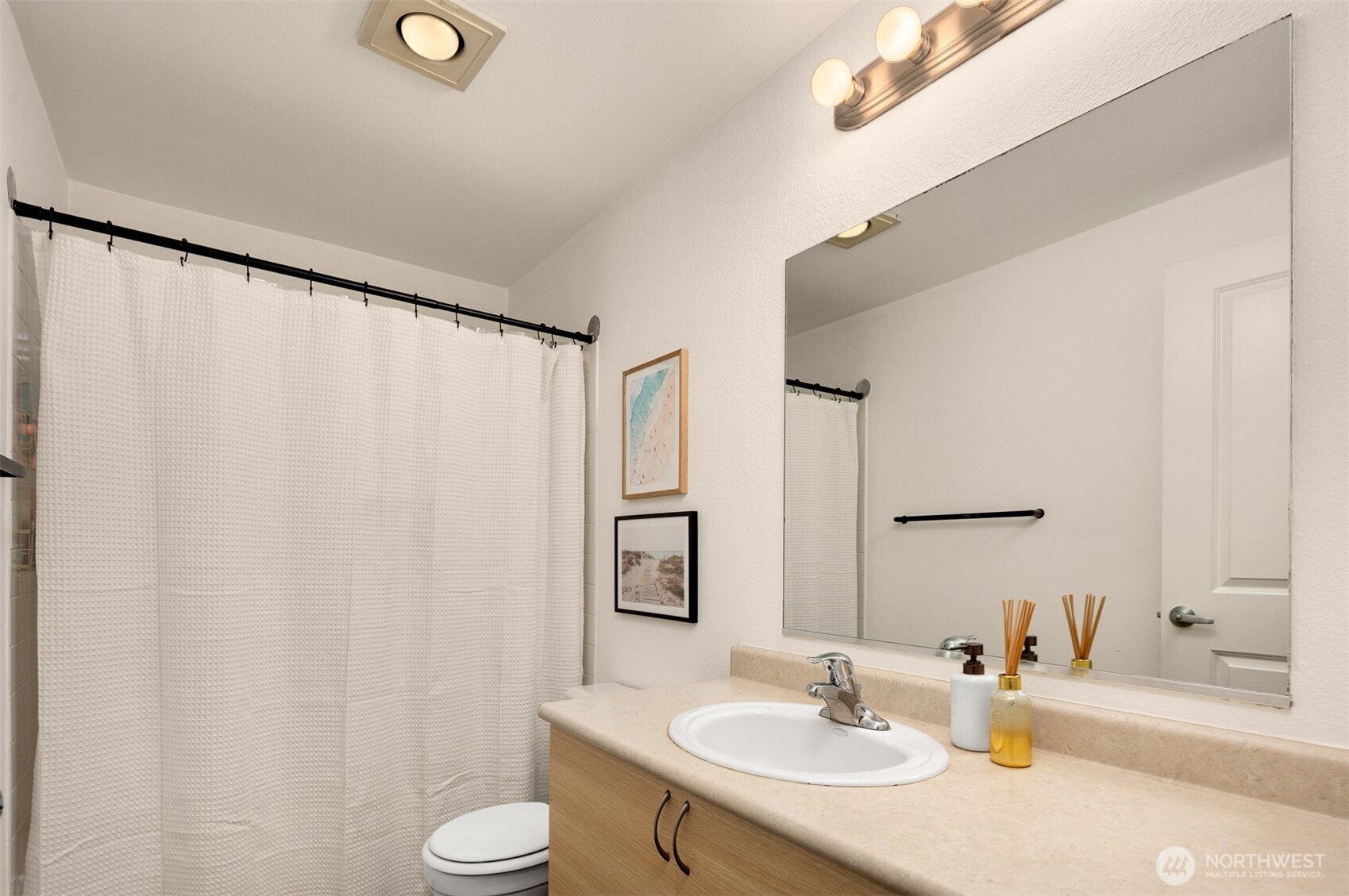 215 9th Street, Unit D102 Kirkland, WA 98033 - Photo 25 of 32 a bathroom with a sink and a mirror