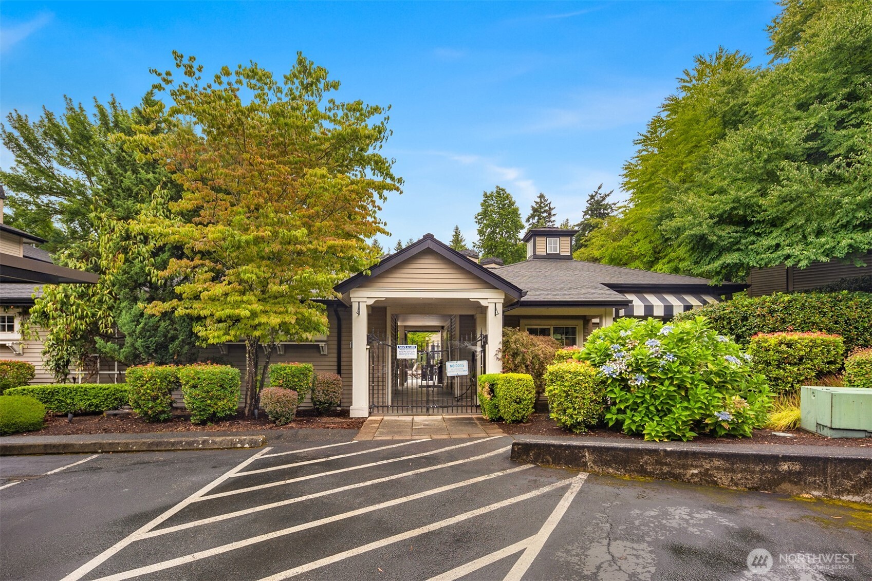 215 9th Street, Unit D102 Kirkland, WA 98033 - Photo 27 of 32 a front view of a house with a yard