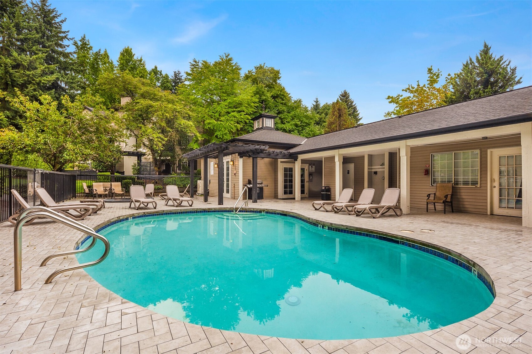 215 9th Street, Unit D102 Kirkland, WA 98033 - Photo 29 of 32 a view of a house with swimming pool