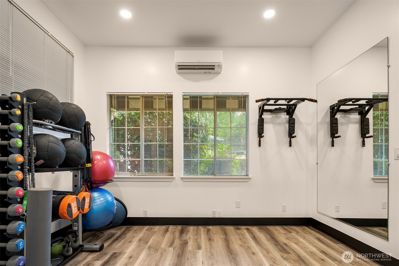 215 9th Street, Unit D102 Kirkland, WA 98033 - Photo 32 of 32 a room with furniture and wooden floor