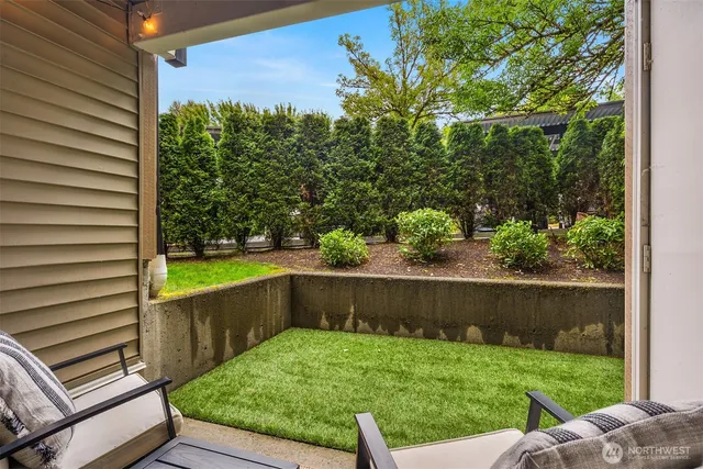 a view of a back yard from a balcony