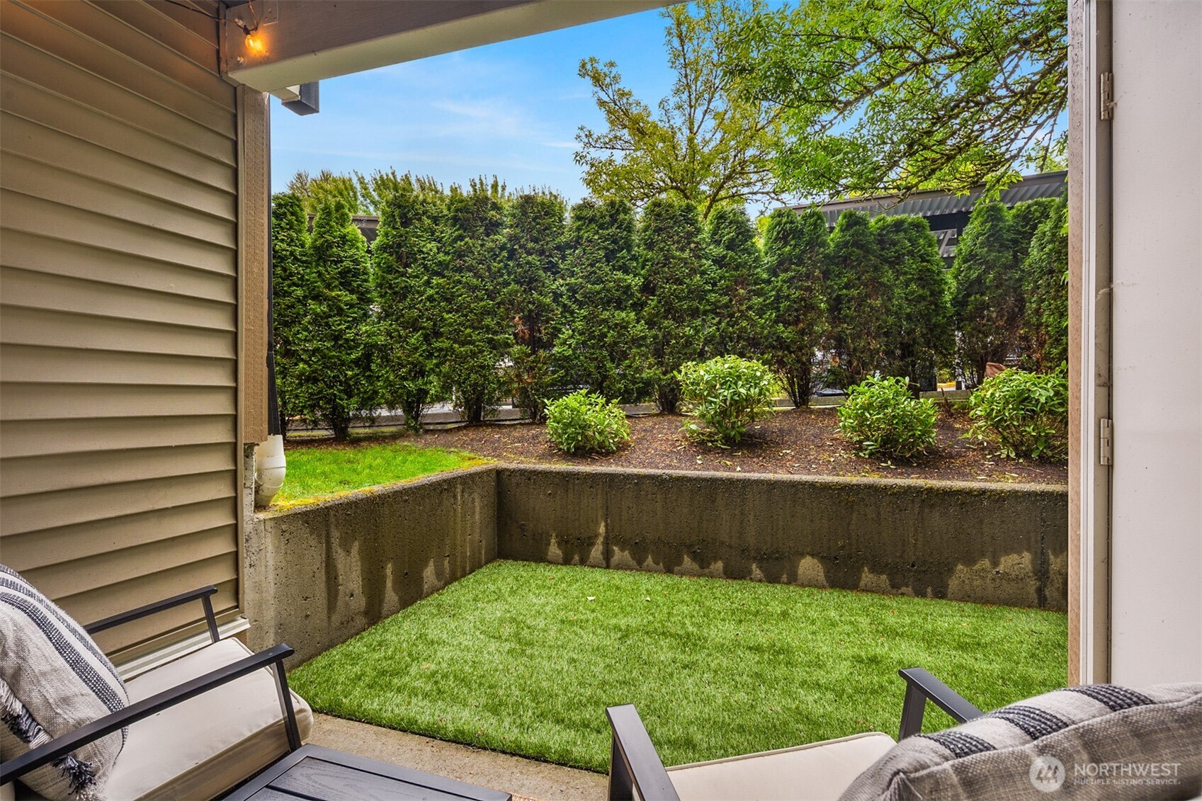 215 9th Street, Unit D102 Kirkland, WA 98033 - Photo 6 of 32 a view of a back yard from a balcony