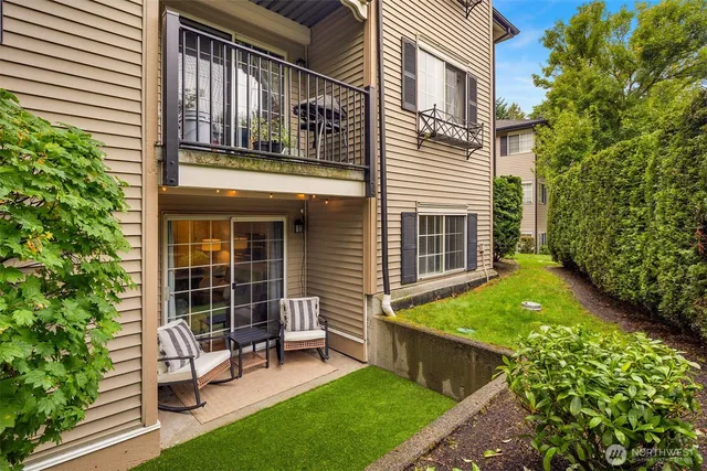 a view of an house with backyard porch and sitting area