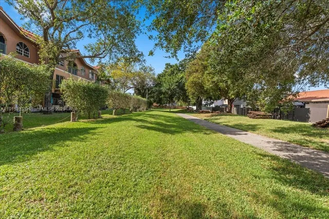 a view of a street with cars