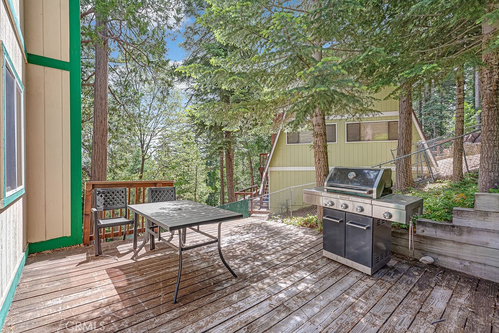 318 Old Toll Road Lake Arrowhead, CA 92352 - Photo 28 of 44 a view of a chairs and table on the wooden floor