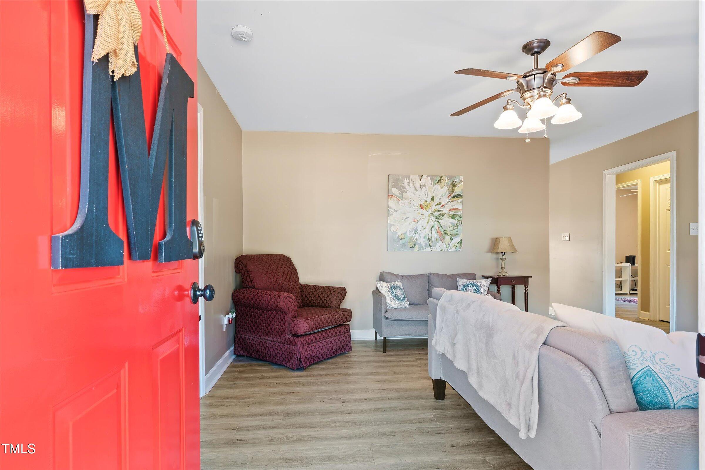 21 Birchwood Circle Coats, NC 27521 - Photo 12 of 36 a living room with furniture and a chandelier