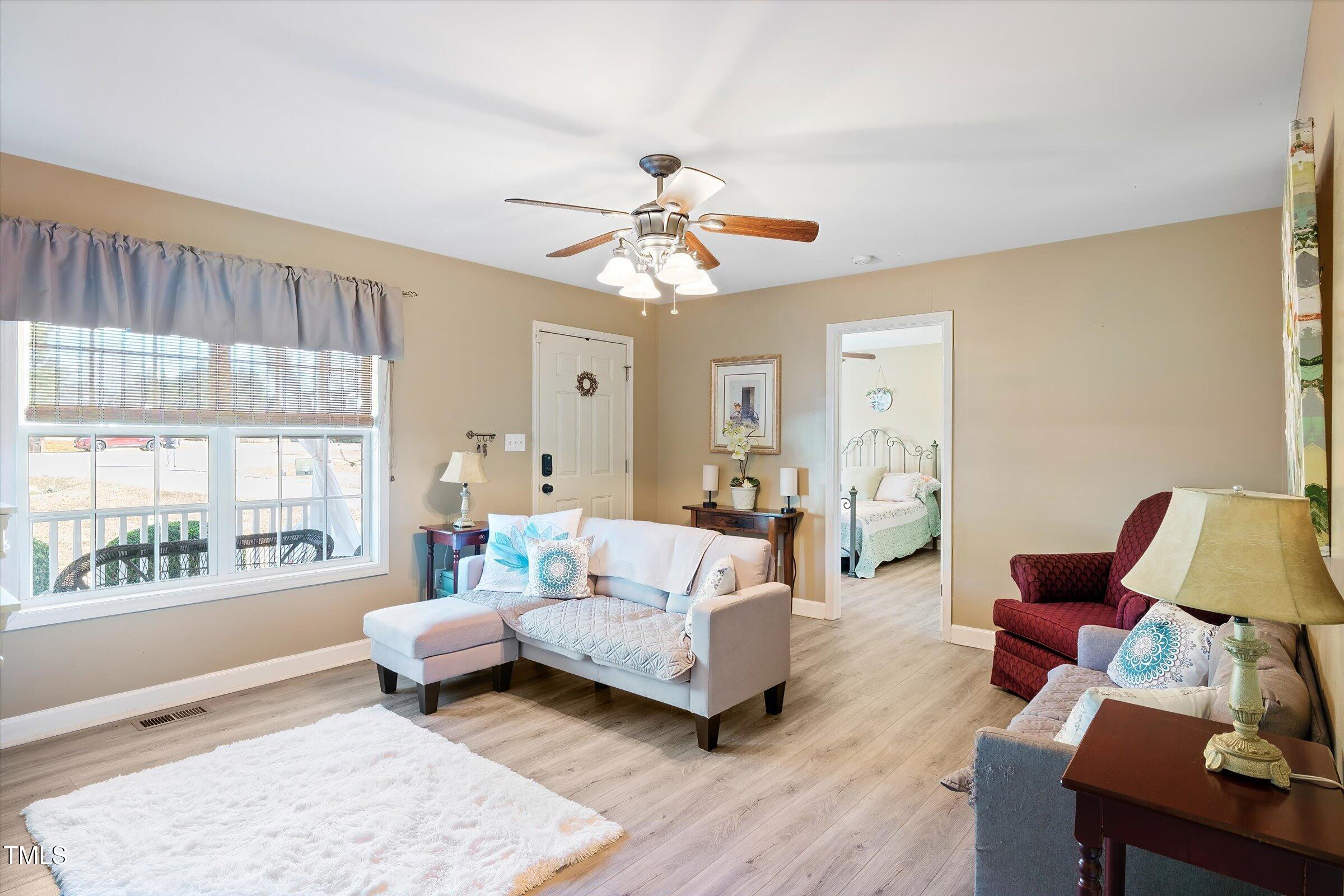 21 Birchwood Circle Coats, NC 27521 - Photo 14 of 36 a living room with furniture and a large window