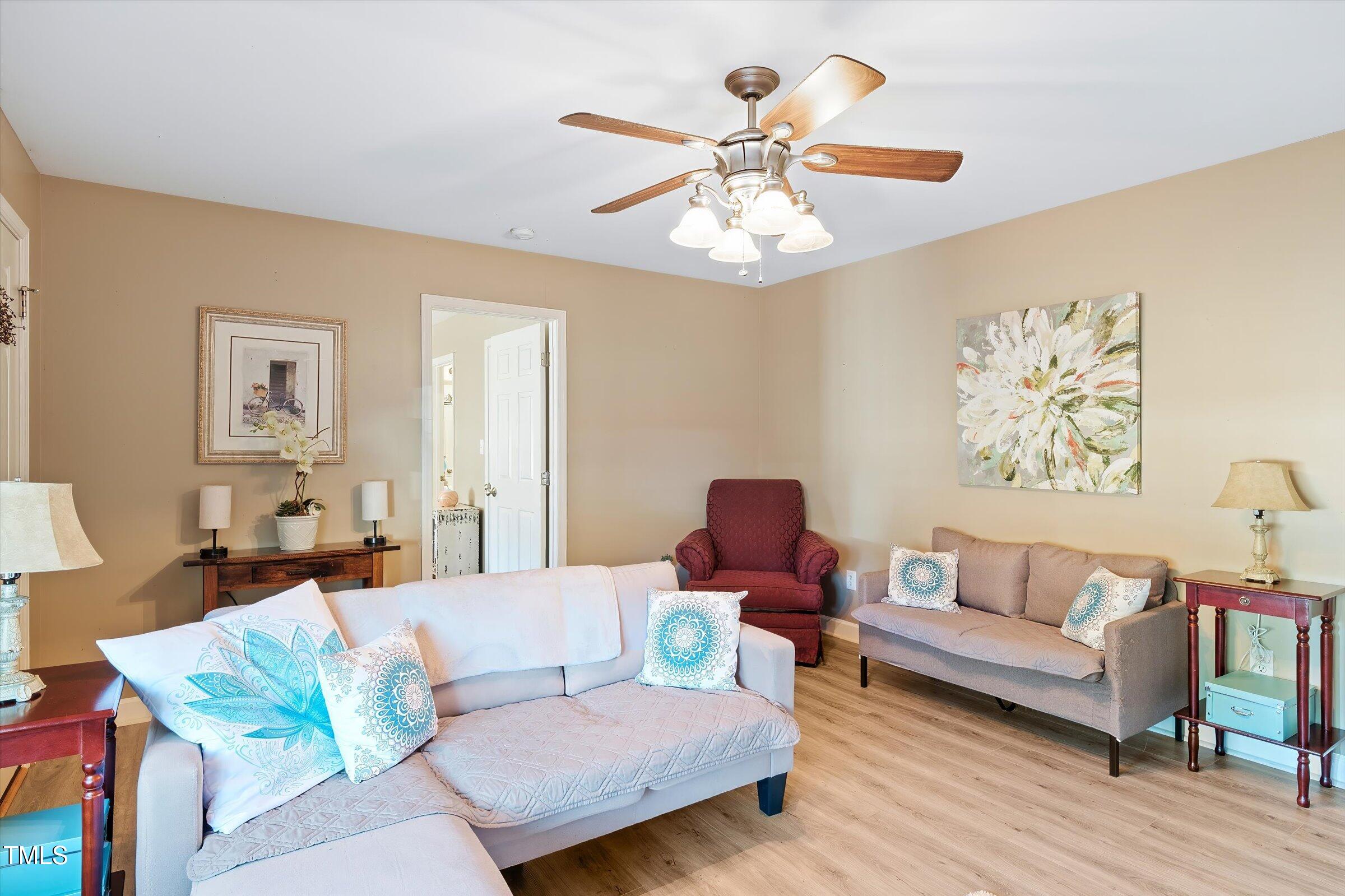 21 Birchwood Circle Coats, NC 27521 - Photo 16 of 36 a living room with furniture and wooden floor