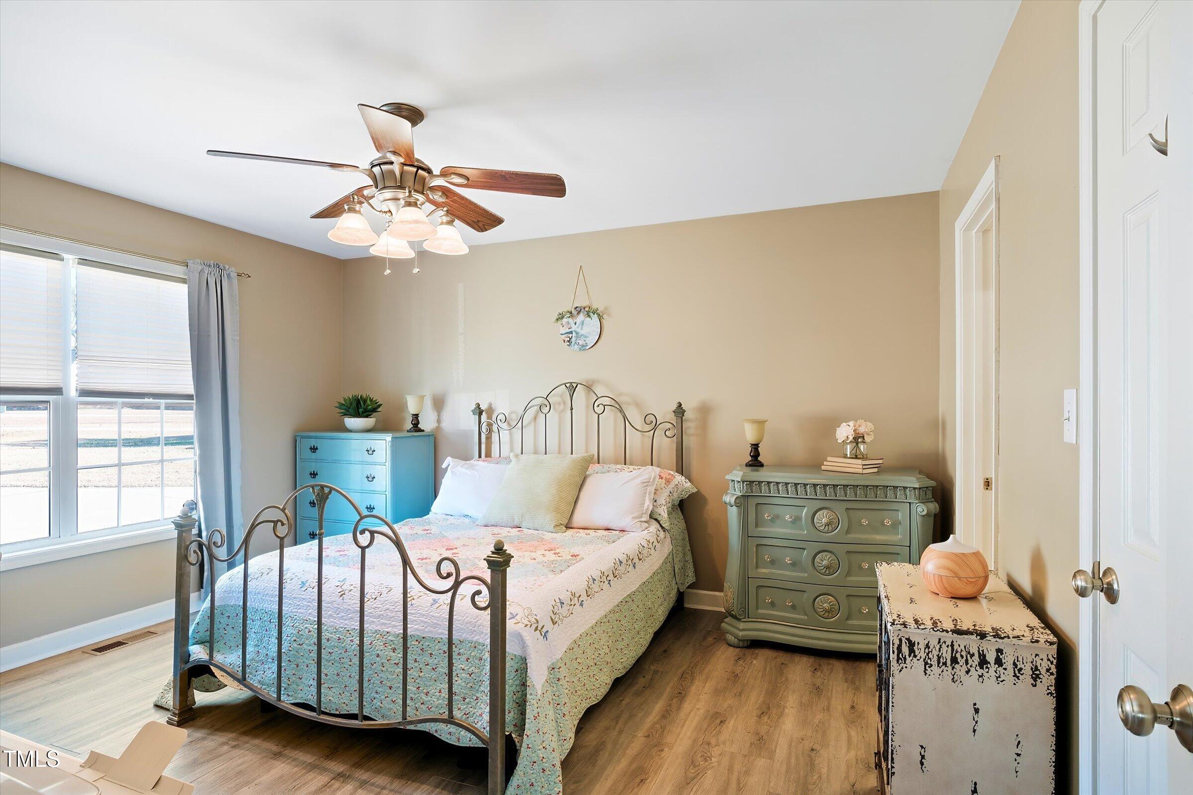 21 Birchwood Circle Coats, NC 27521 - Photo 17 of 36 a bedroom with a bed and window