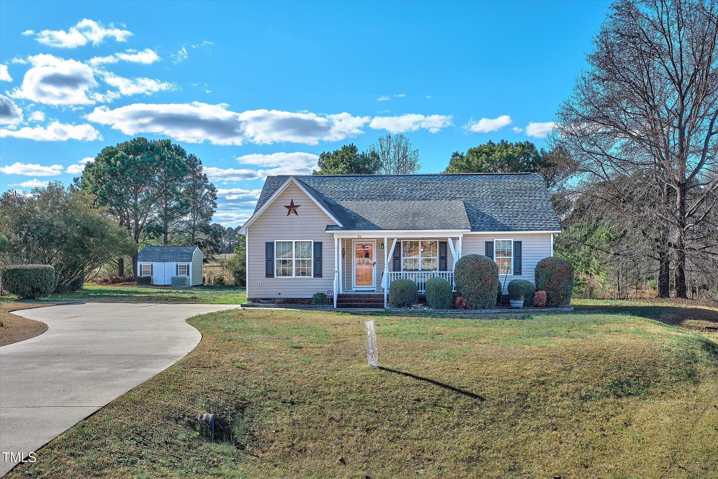 21 Birchwood Circle Coats, NC 27521 - Photo 2 of 36 a view of a house with a yard