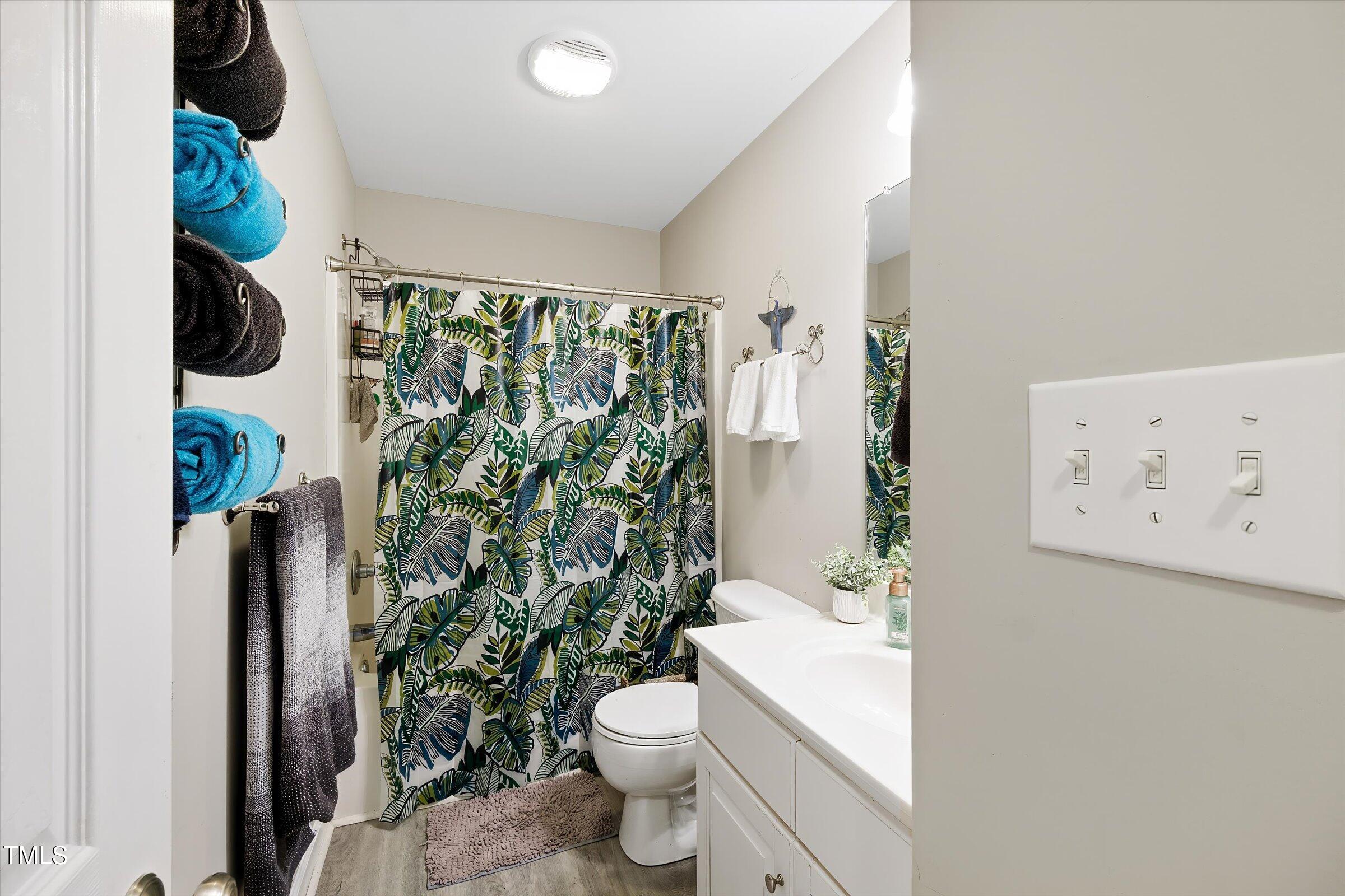 21 Birchwood Circle Coats, NC 27521 - Photo 25 of 36 a white toilet sitting next to a bathroom sink