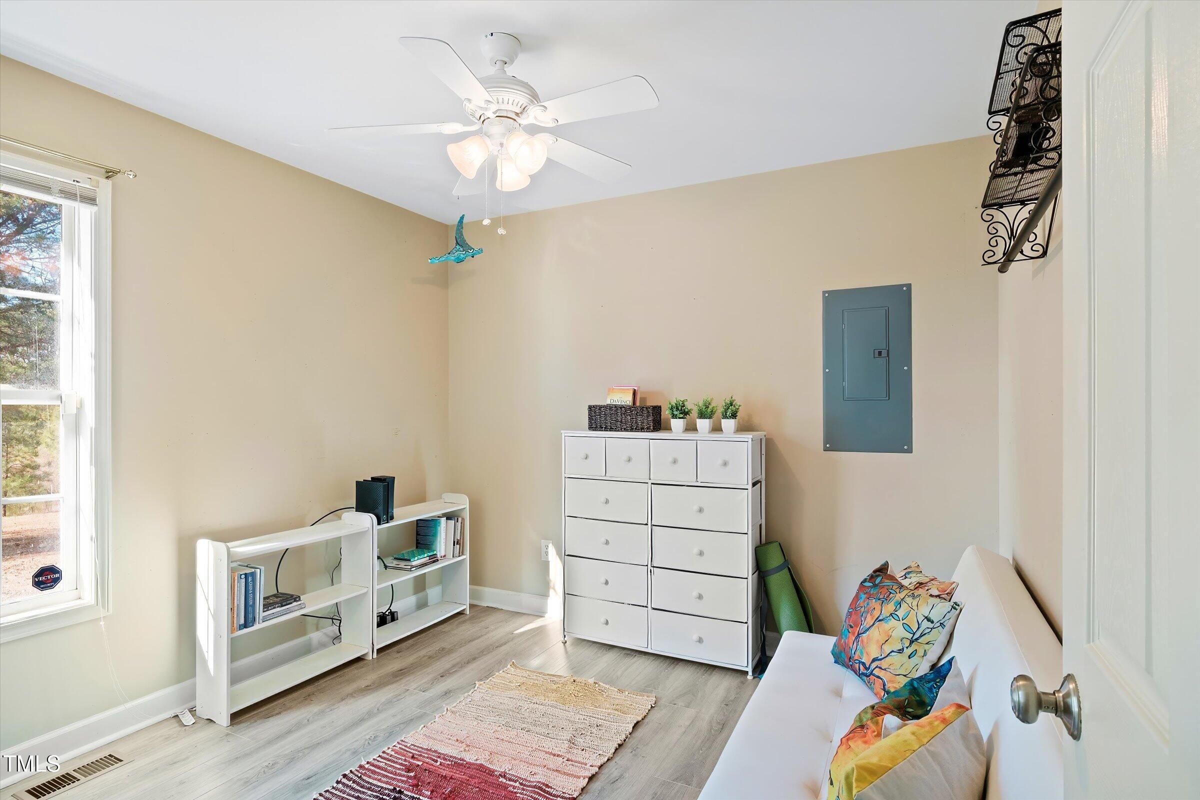 21 Birchwood Circle Coats, NC 27521 - Photo 26 of 36 a bedroom with a bed and a dresser
