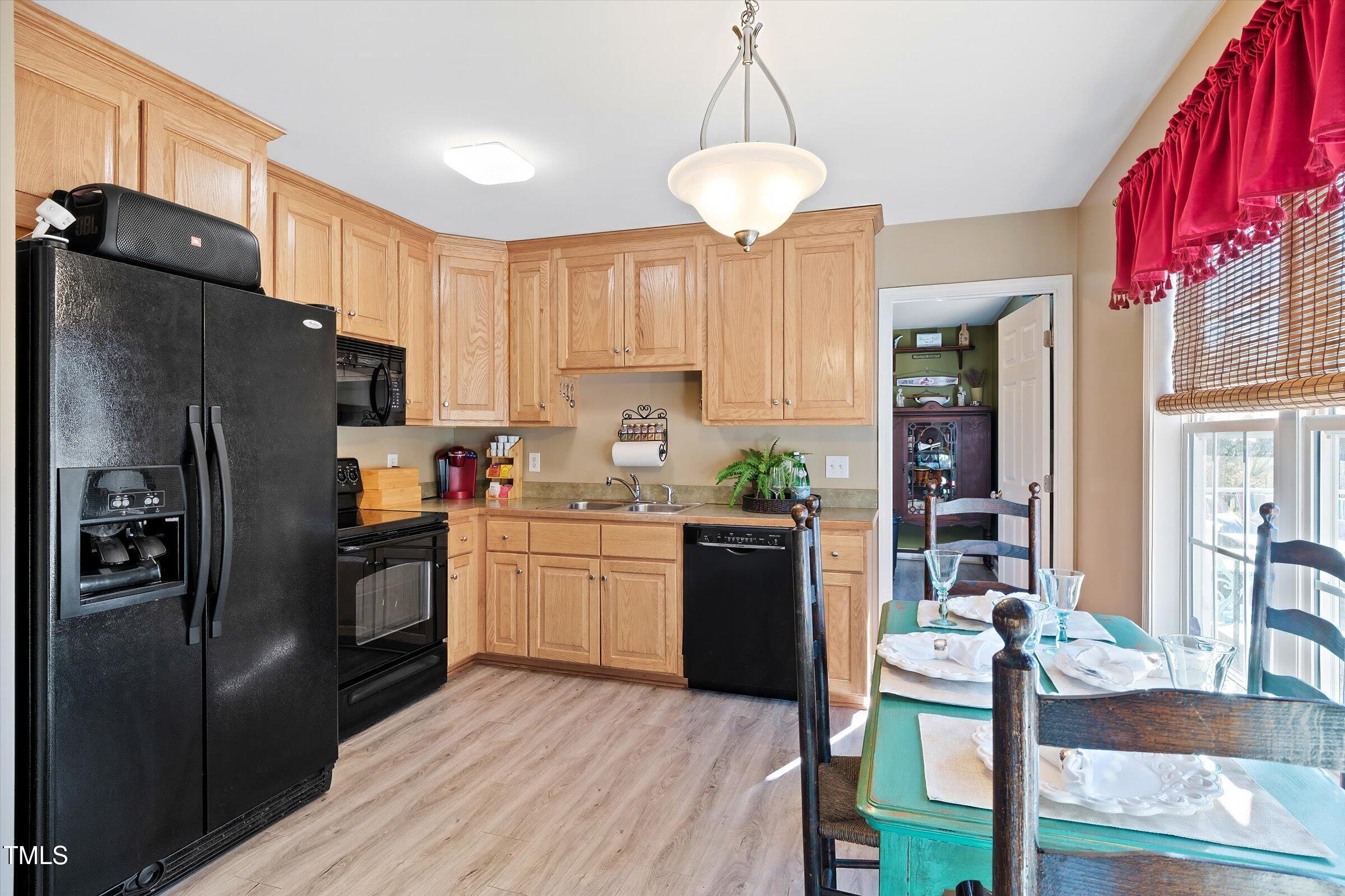 21 Birchwood Circle Coats, NC 27521 - Photo 29 of 36 a kitchen with stainless steel appliances granite countertop a refrigerator a stove a sink and a refrigerator