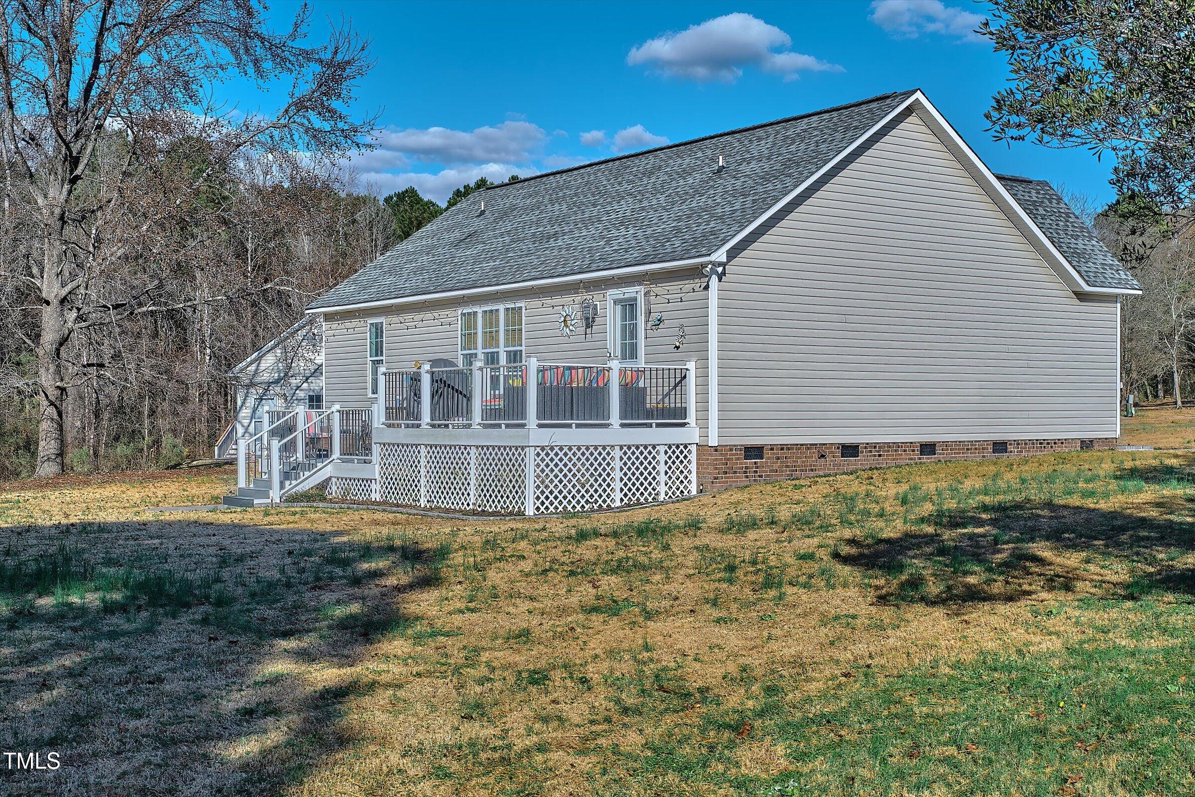 21 Birchwood Circle Coats, NC 27521 - Photo 3 of 36 a house with trees in the background