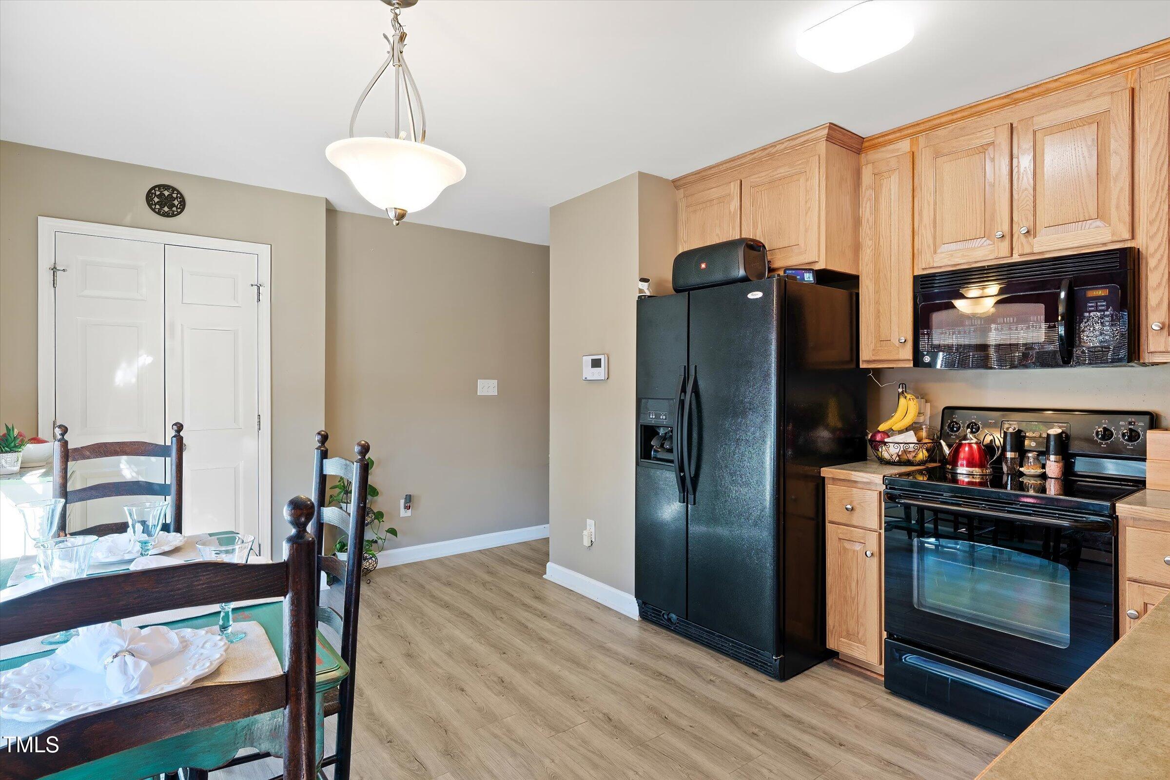 21 Birchwood Circle Coats, NC 27521 - Photo 31 of 36 a kitchen with stainless steel appliances granite countertop a refrigerator stove and cabinets