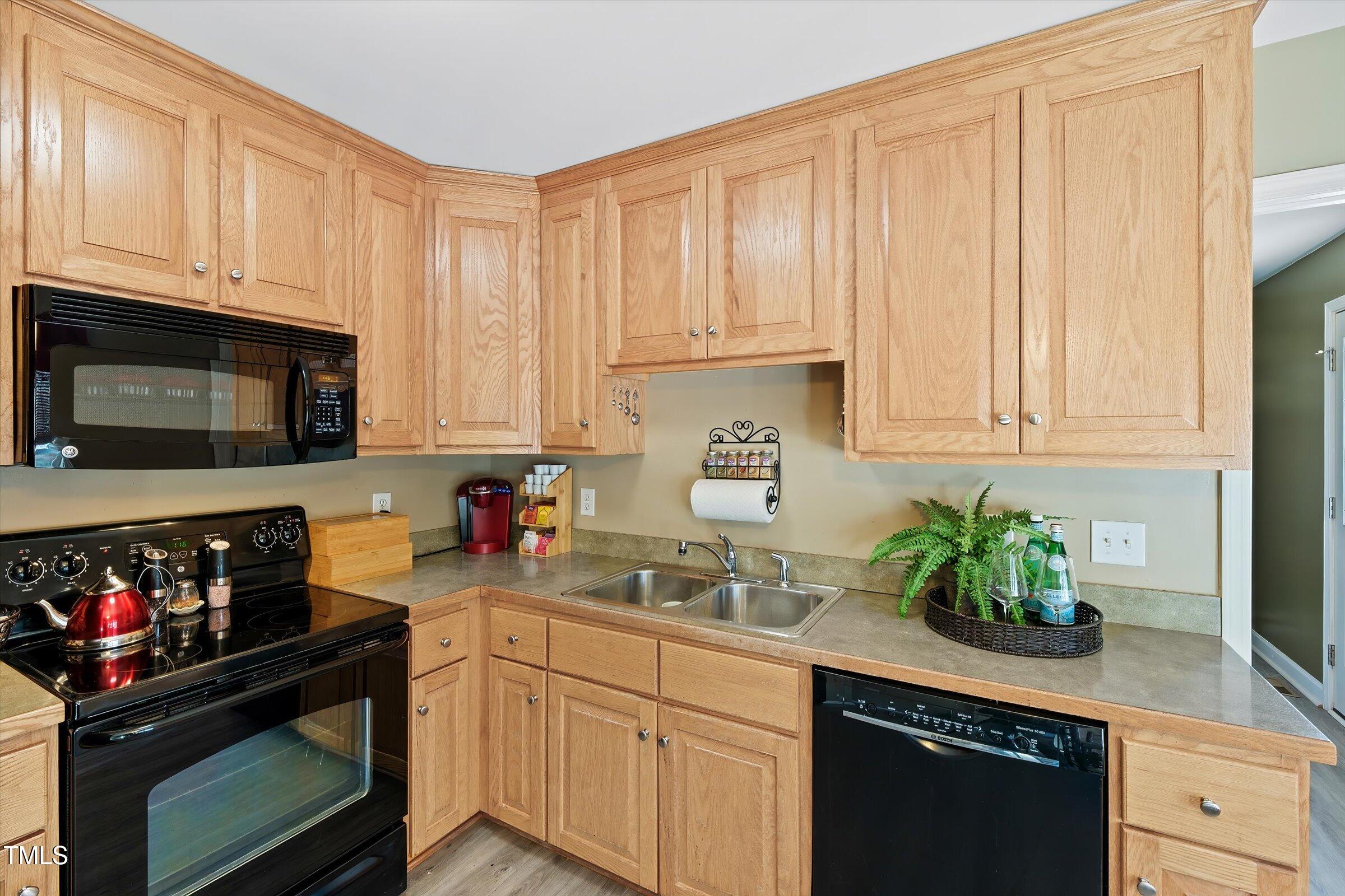 21 Birchwood Circle Coats, NC 27521 - Photo 32 of 36 a kitchen with stainless steel appliances granite countertop a sink a stove and cabinets
