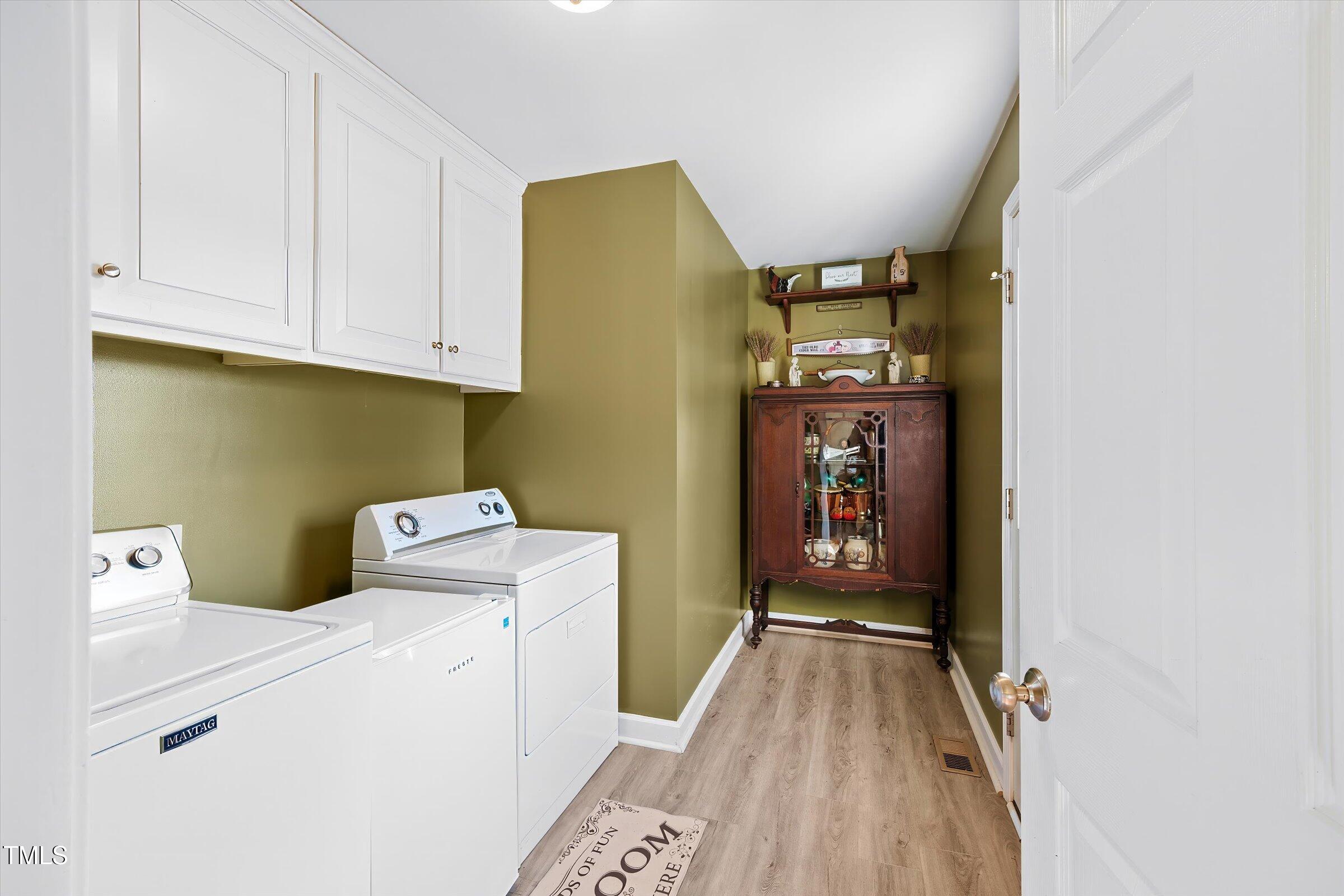 21 Birchwood Circle Coats, NC 27521 - Photo 33 of 36 a view of hallway with washer and dryer