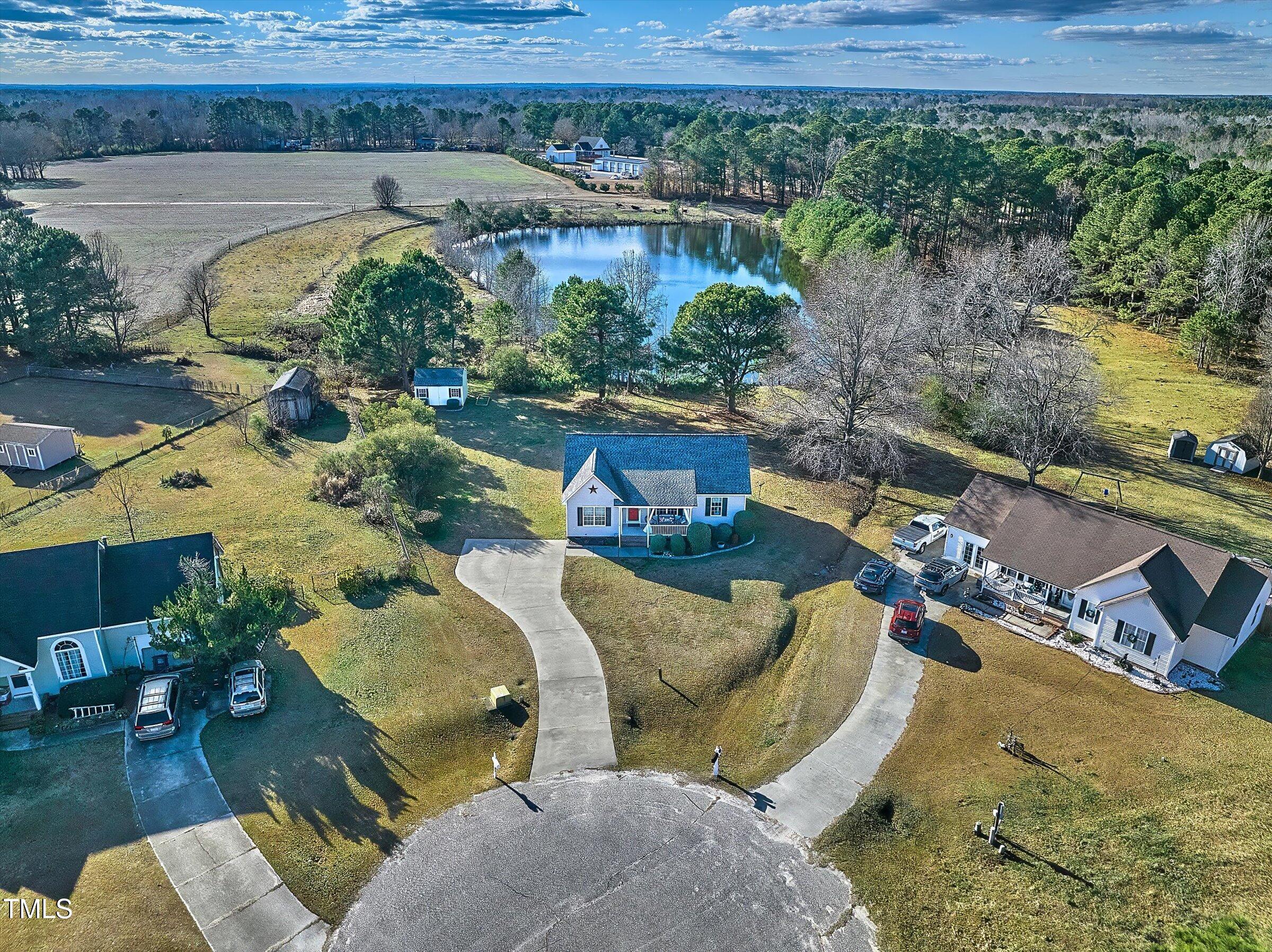 21 Birchwood Circle Coats, NC 27521 - Photo 8 of 36 a view of a swimming pool with lawn chairs