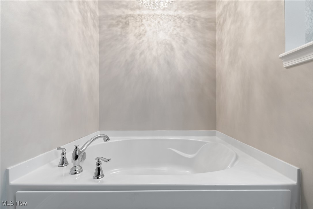191 Ry Road Wadsworth, OH 44281 - Photo 15 of 34 Full bath featuring a bath and a chandelier