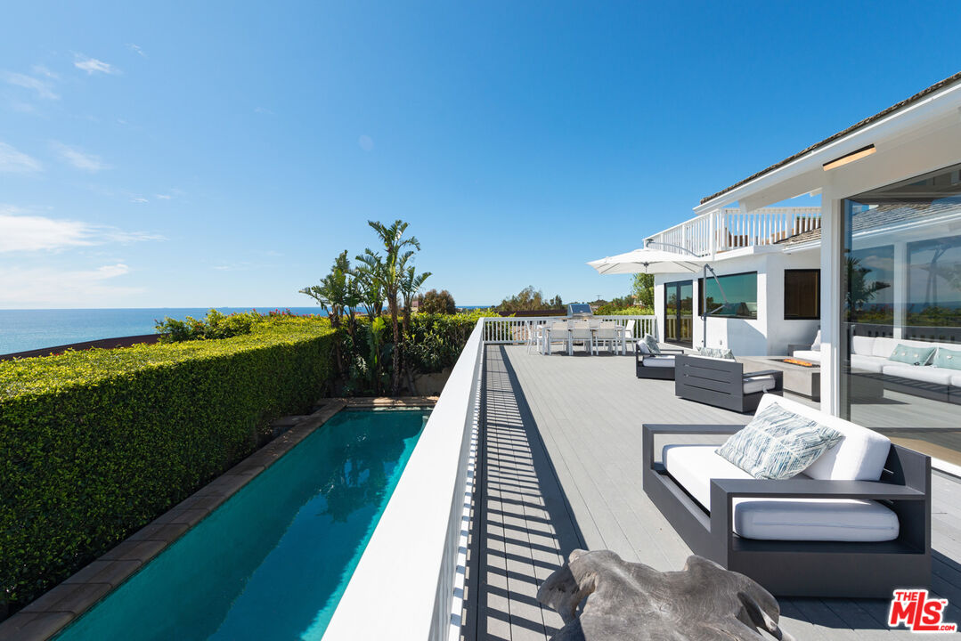 a view of a patio with swimming pool