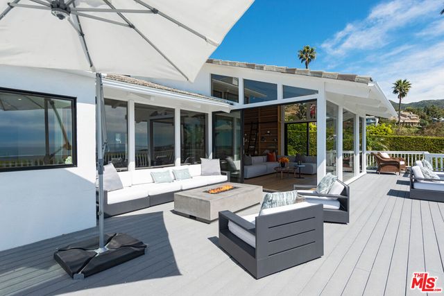 a view of balcony with furniture