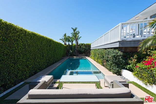 a view of balcony with a yard