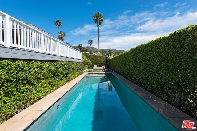 a view of a chairs and table in the patio