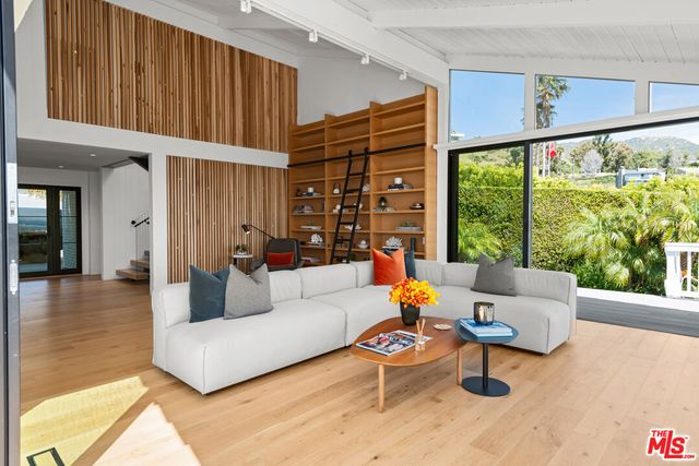 a view of a dining room kitchen with furniture and wooden floor