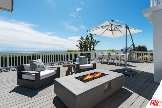 a view of a roof deck with couches