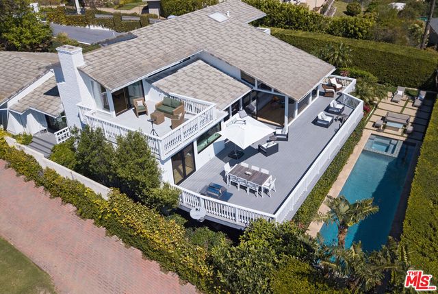 an aerial view of a house with a garden