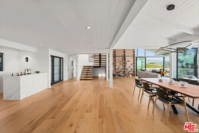 a view of a living room and dining room