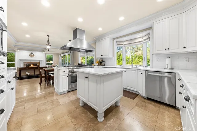 a kitchen with stainless steel appliances a refrigerator sink and microwave