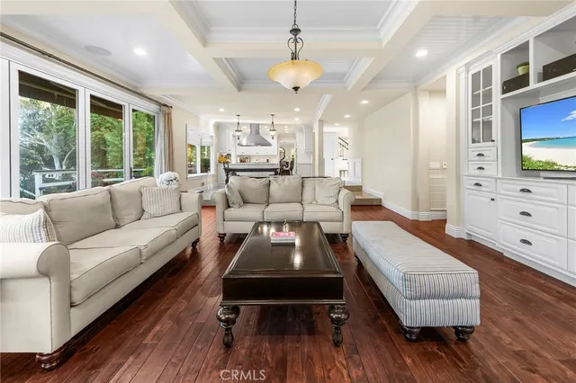 a bed room with a bed and a chandelier